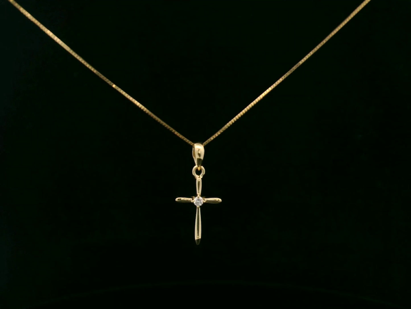 0.02 carat diamond cross pendant in 18K yellow gold minimalist necklace by Emirates Diamonds