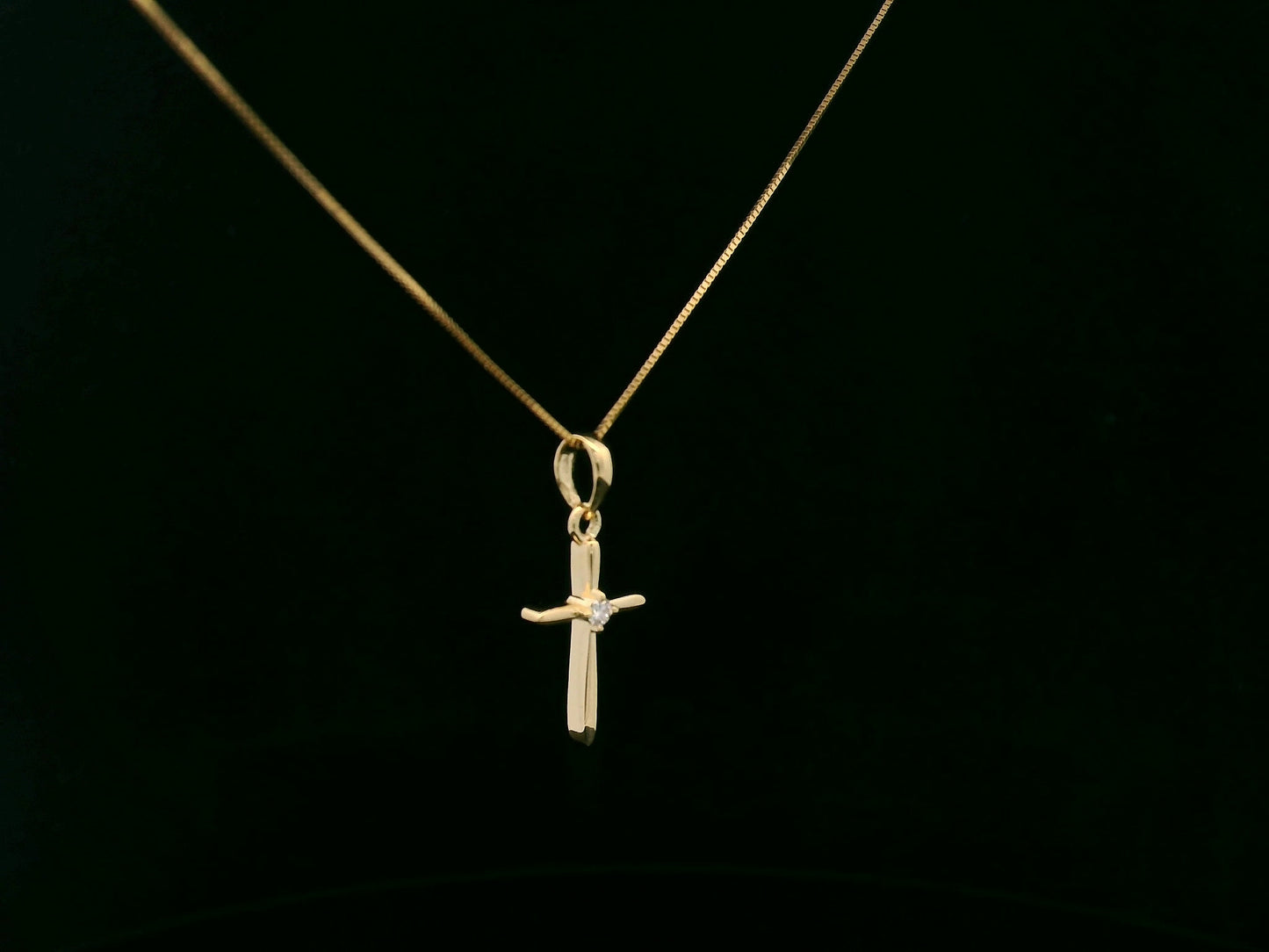 0.02 carat diamond cross pendant in 18K yellow gold minimalist necklace by Emirates Diamonds