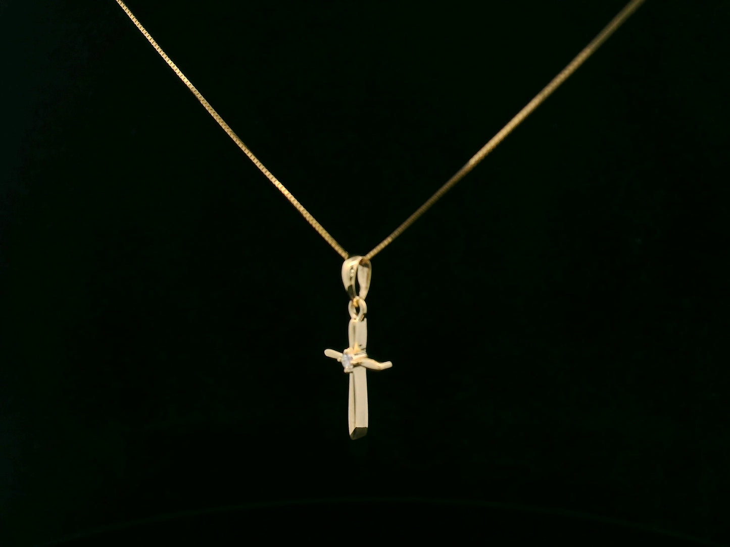 0.02 carat diamond cross pendant in 18K yellow gold minimalist necklace by Emirates Diamonds