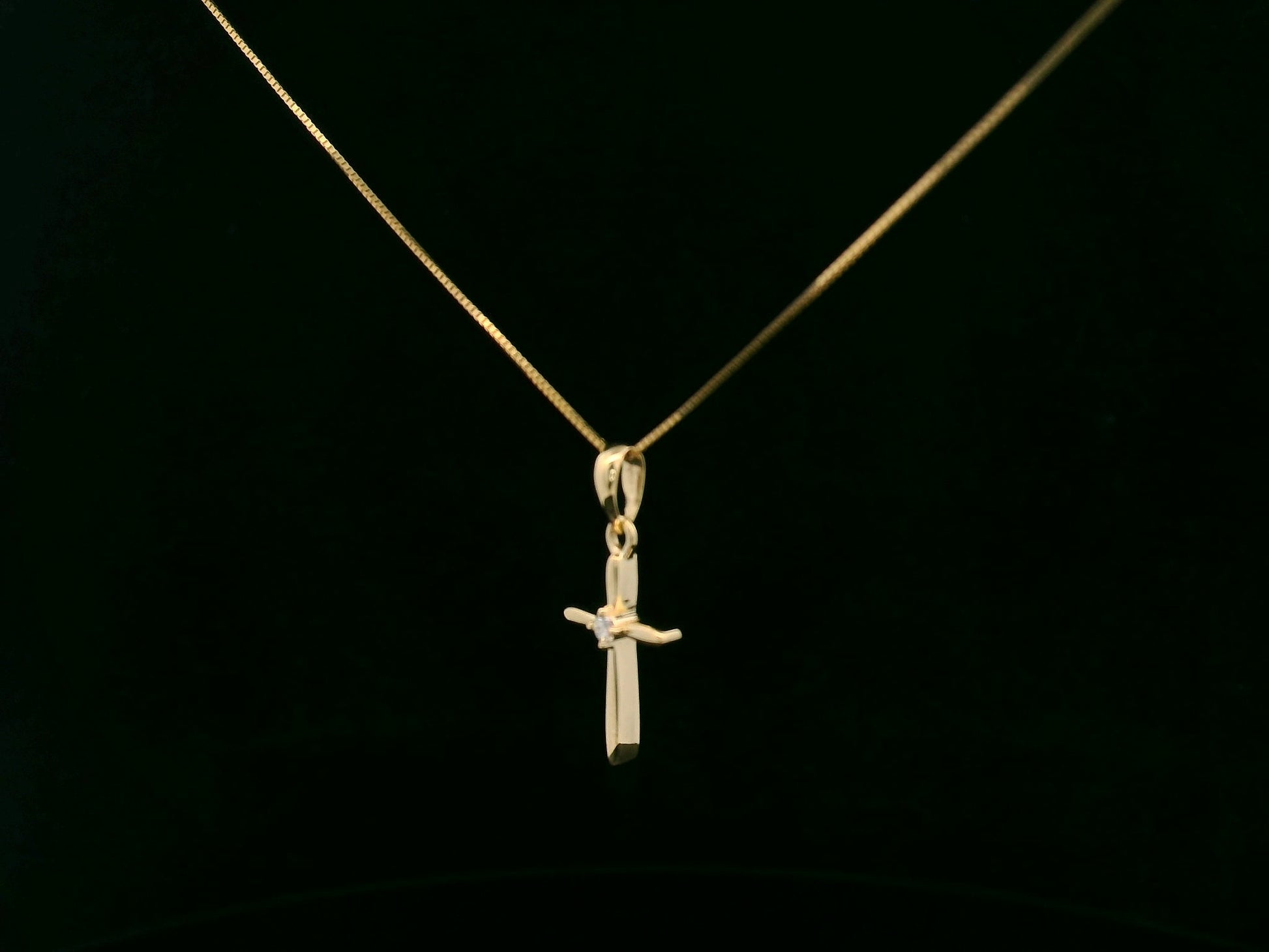 0.02 carat diamond cross pendant in 18K yellow gold minimalist necklace by Emirates Diamonds