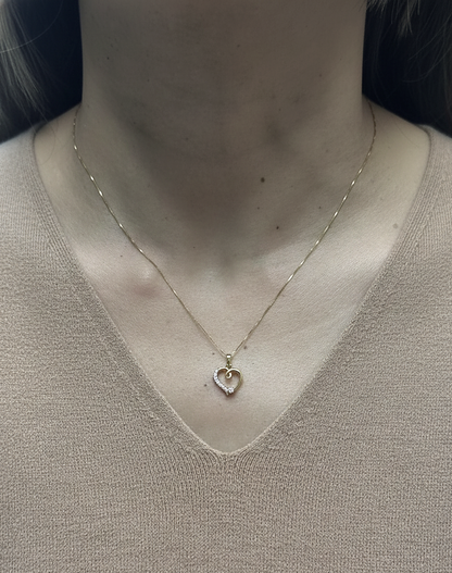 18K yellow gold diamond heart pendant with delicate open-heart design by Emirates Diamonds.