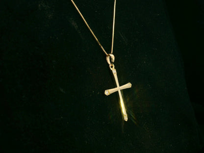 18K yellow gold diamond cross pendant with minimalist design by Emirates Diamonds.