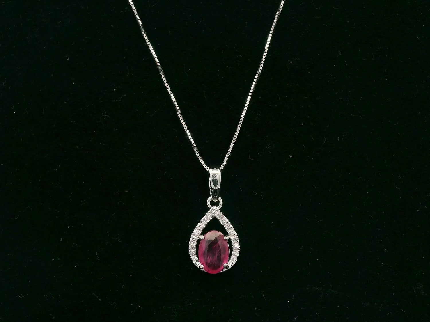18K white gold ruby and diamond teardrop pendant with pear-shaped frame, Emirates Diamonds