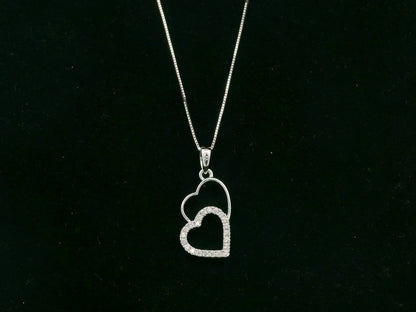 18K white gold double heart diamond pendant necklace with pavé diamonds – fine jewelry by Emirates Diamonds