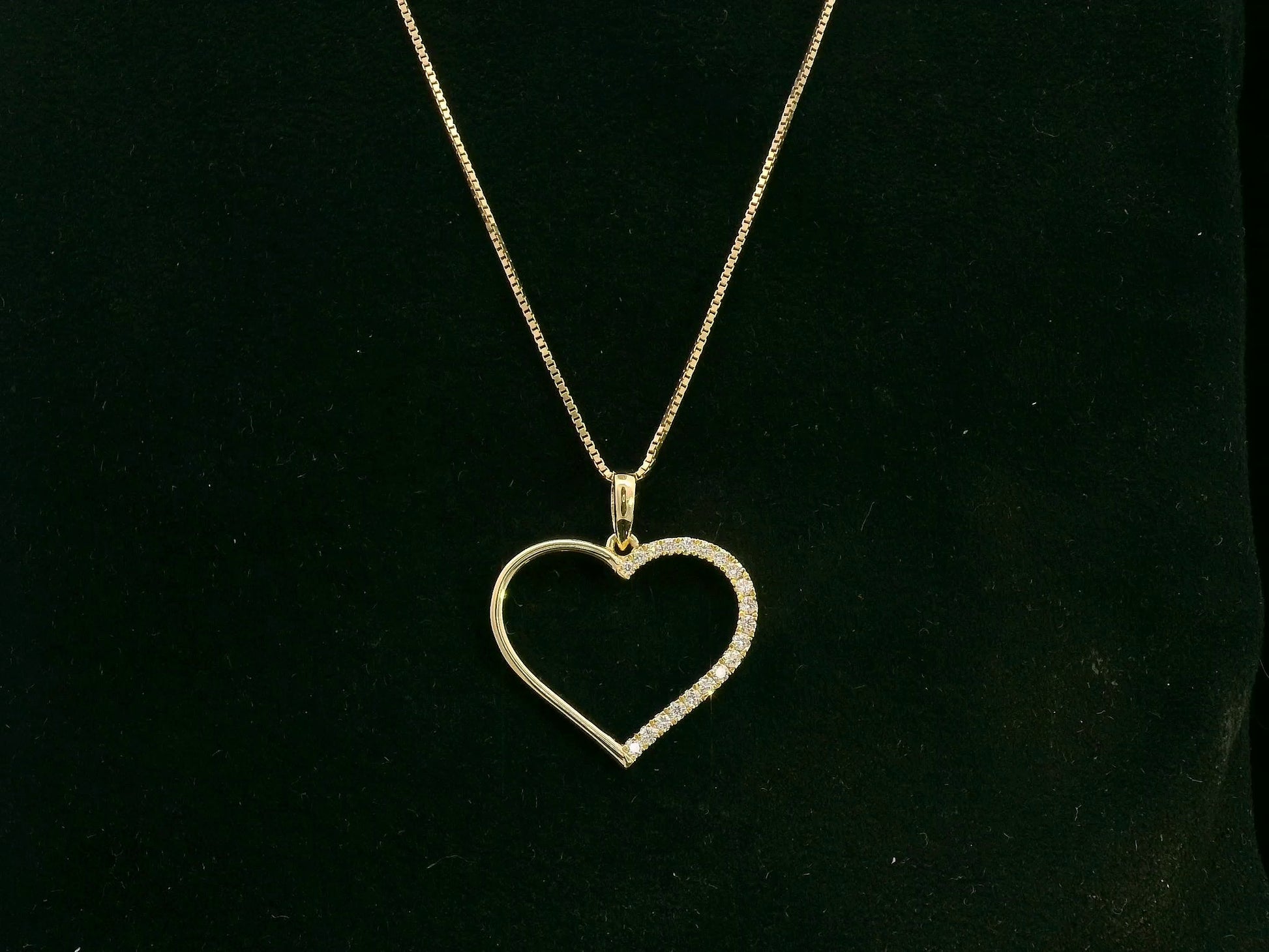 18K yellow gold open heart pendant with 0.15 carat natural diamonds by Emirates Diamonds