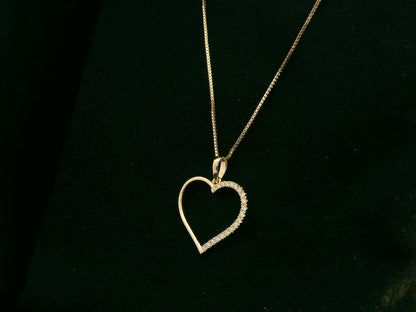 18K yellow gold open heart pendant with 0.15 carat natural diamonds by Emirates Diamonds