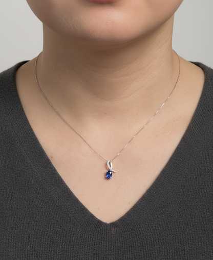 Oval blue sapphire and diamond pendant in 18K white gold by Emirates Diamonds