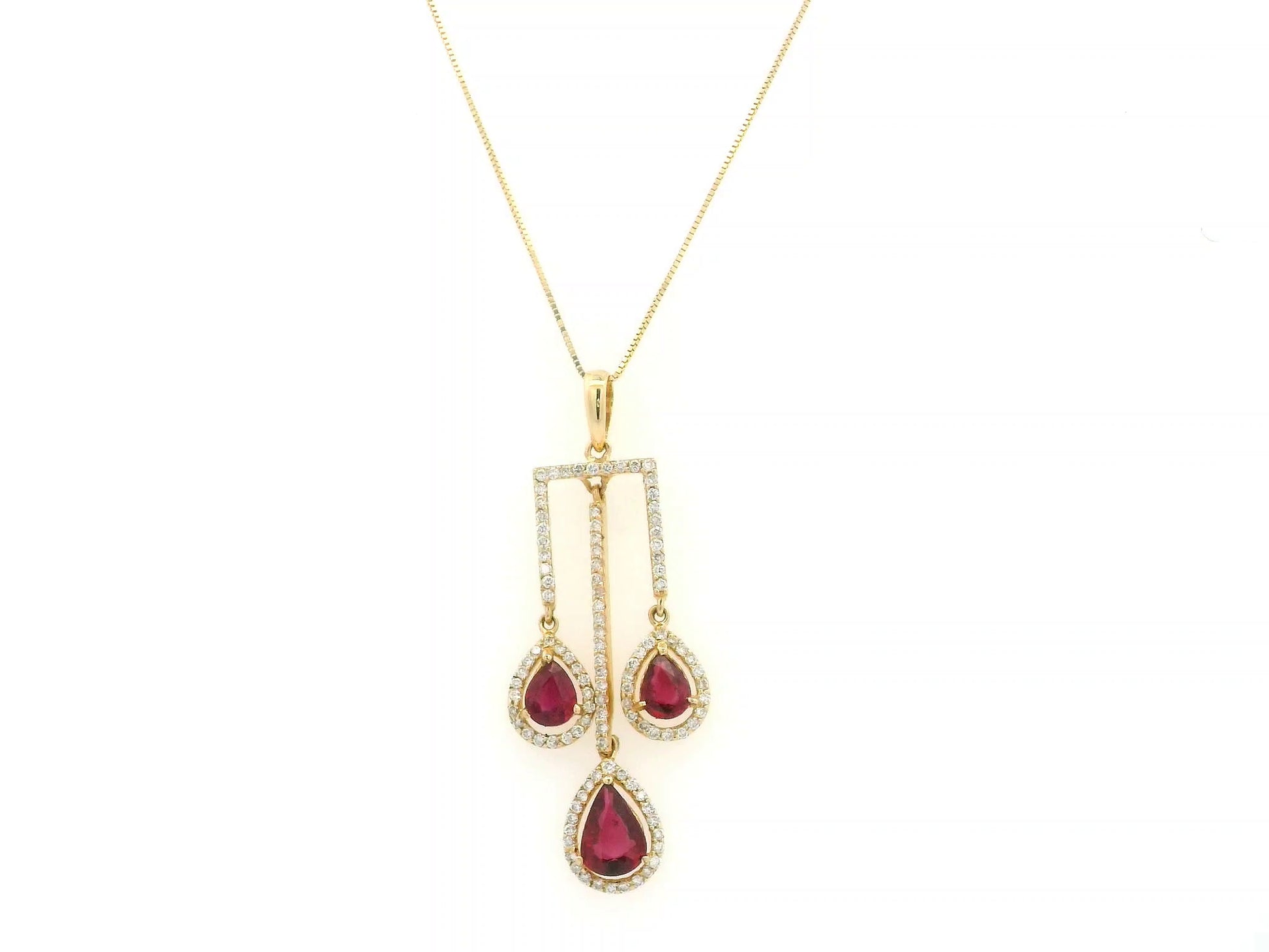 18K yellow gold ruby drop pendant with pear-cut rubies and diamond halo detailing by Emirates Diamonds