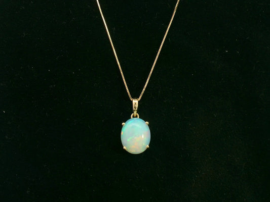 18K yellow gold oval opal pendant with natural play of color by Emirates Diamonds