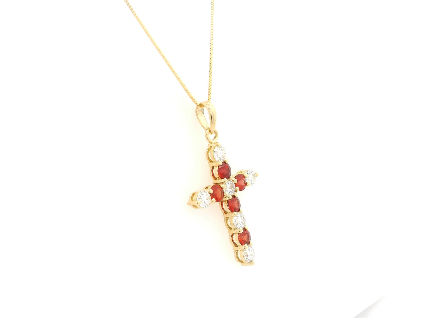 18K yellow gold cross pendant with round orange sapphires and diamonds by Emirates Diamonds
