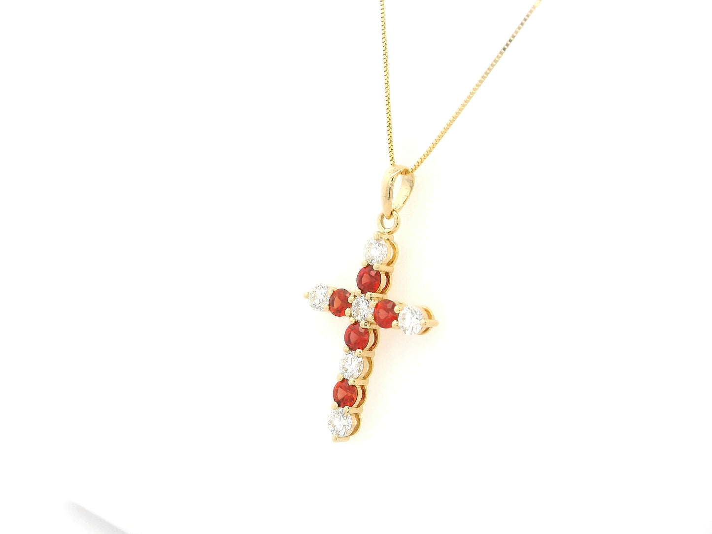18K yellow gold cross pendant with round orange sapphires and diamonds by Emirates Diamonds