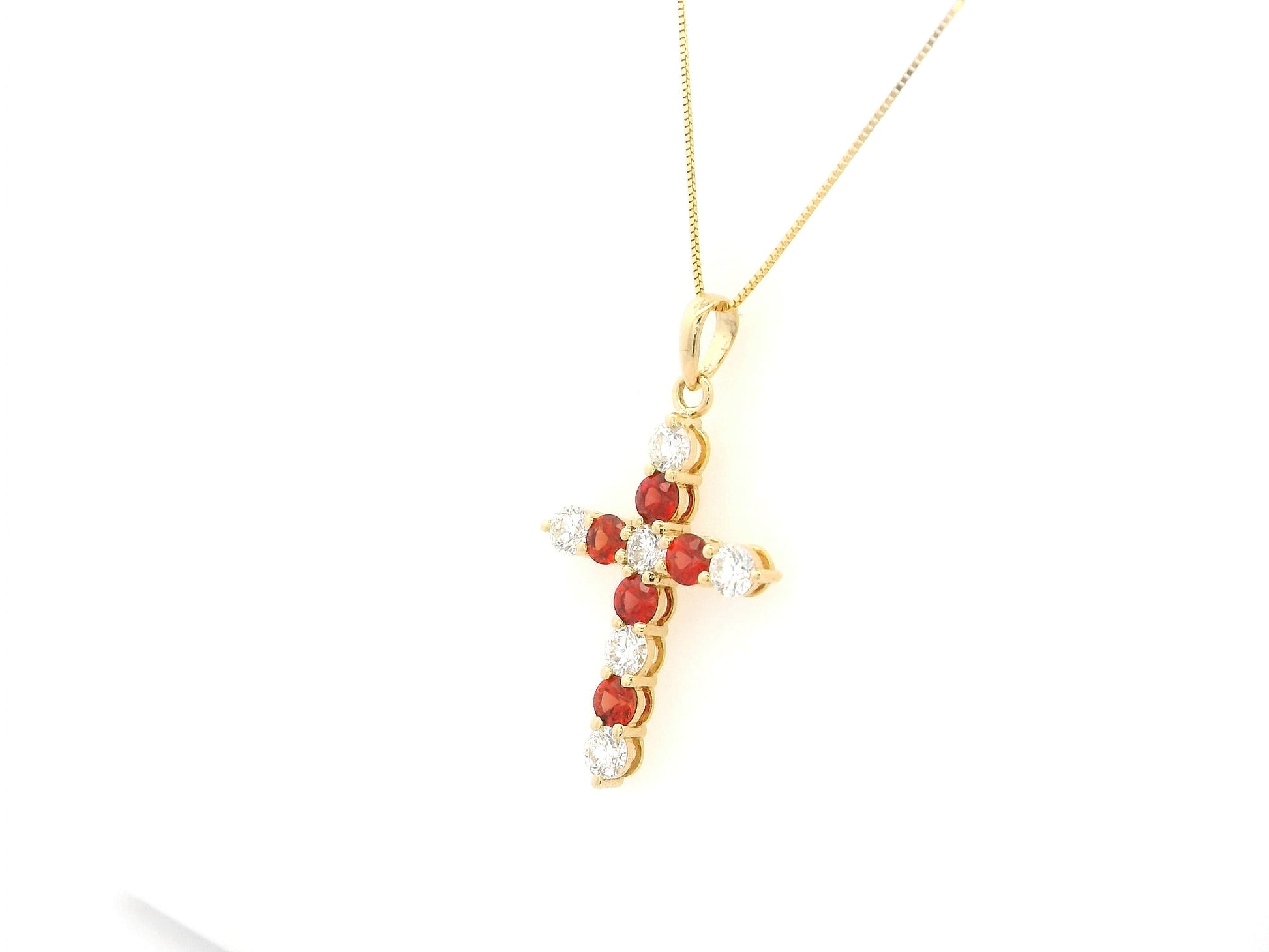 18K yellow gold cross pendant with round orange sapphires and diamonds by Emirates Diamonds