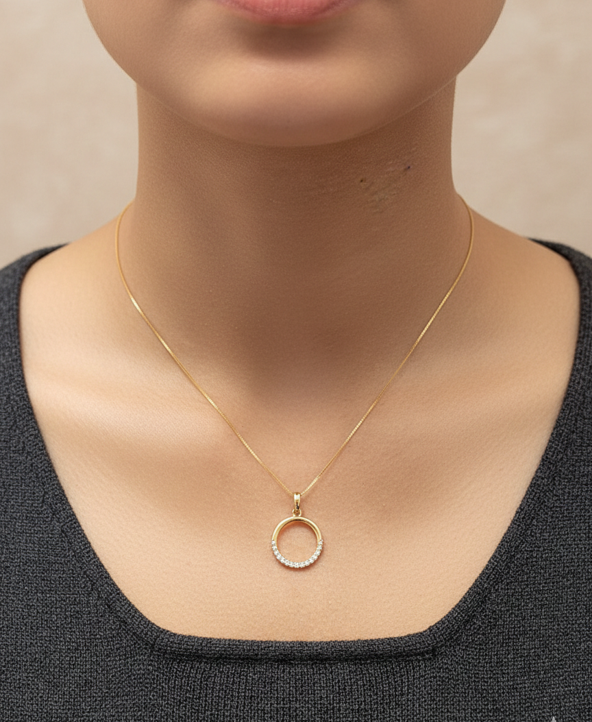 18K yellow gold diamond circle pendant with pavé-set diamonds in an open eternity design by Emirates Diamonds.