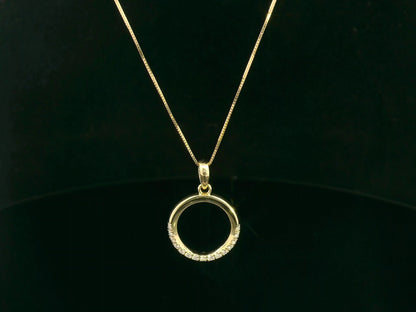 18K yellow gold diamond circle pendant with pavé-set diamonds in an open eternity design by Emirates Diamonds.