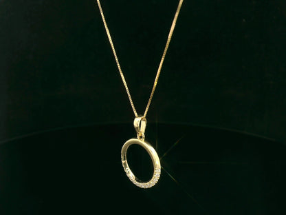18K yellow gold diamond circle pendant with pavé-set diamonds in an open eternity design by Emirates Diamonds.