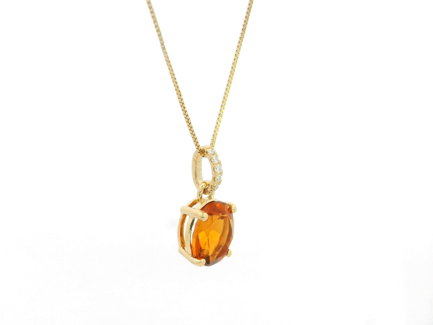 1.53 carat oval citrine and diamond pendant in 18K yellow gold by Emirates Diamonds