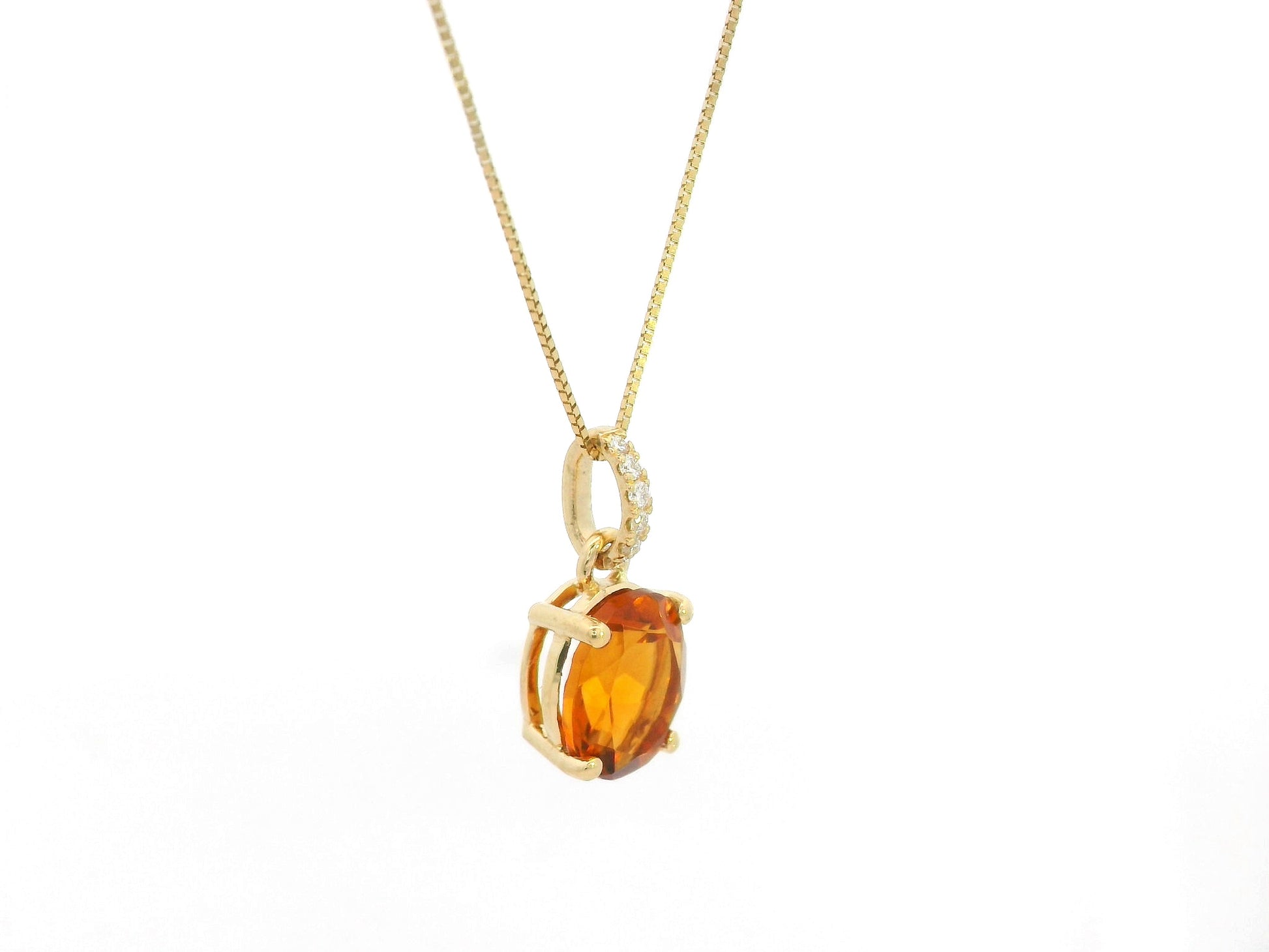 1.53 carat oval citrine and diamond pendant in 18K yellow gold by Emirates Diamonds