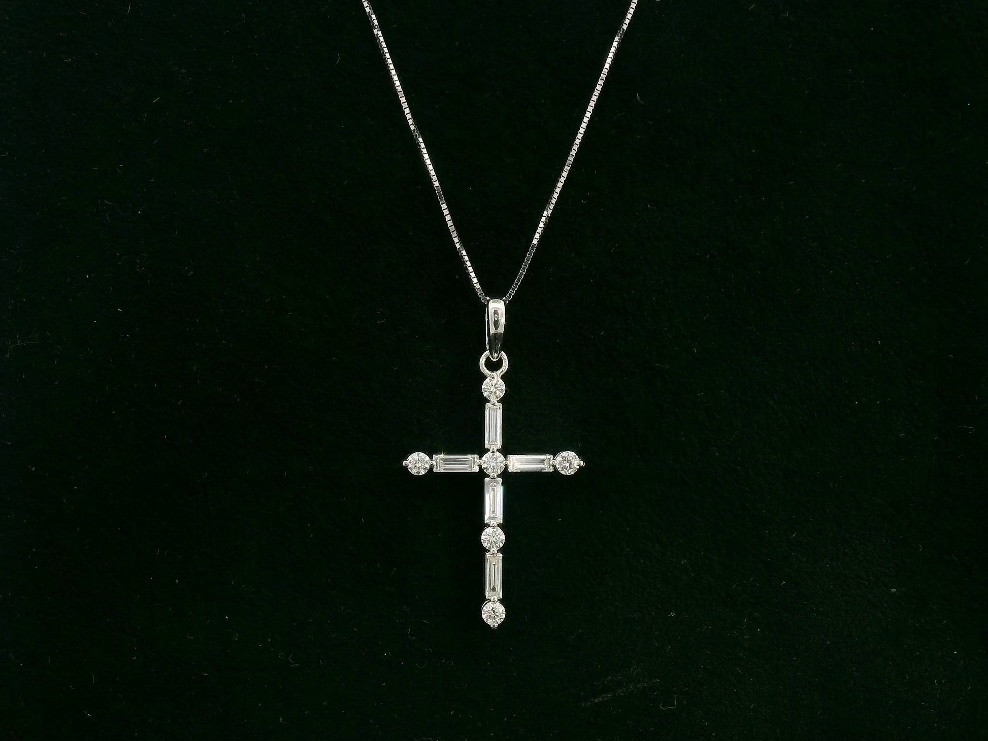 18K white gold diamond cross pendant with round and baguette diamonds by Emirates Diamonds