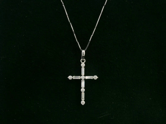 18K white gold diamond cross pendant with round and baguette diamonds by Emirates Diamonds