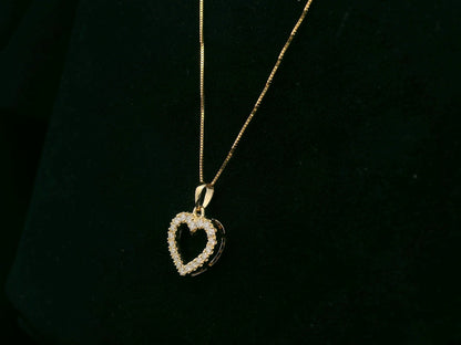 18K yellow gold diamond heart pendant with pavé-set diamonds, elegant open heart design by Emirates Diamonds.