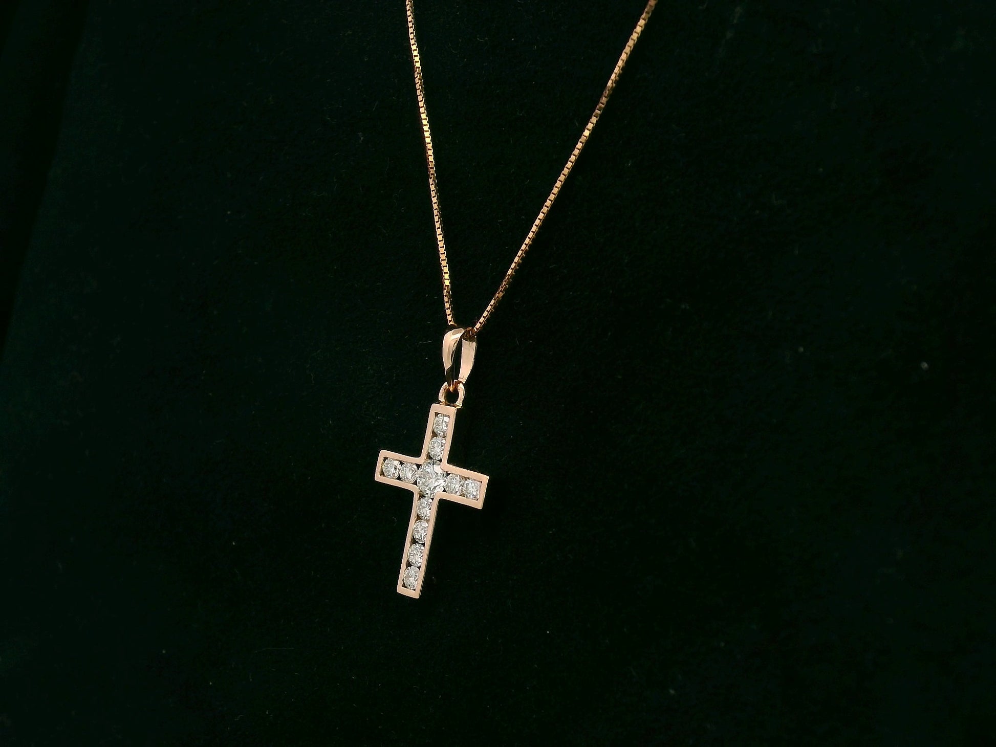 Diamond cross pendant in 18K rose gold with prong-set natural diamonds by Emirates Diamonds