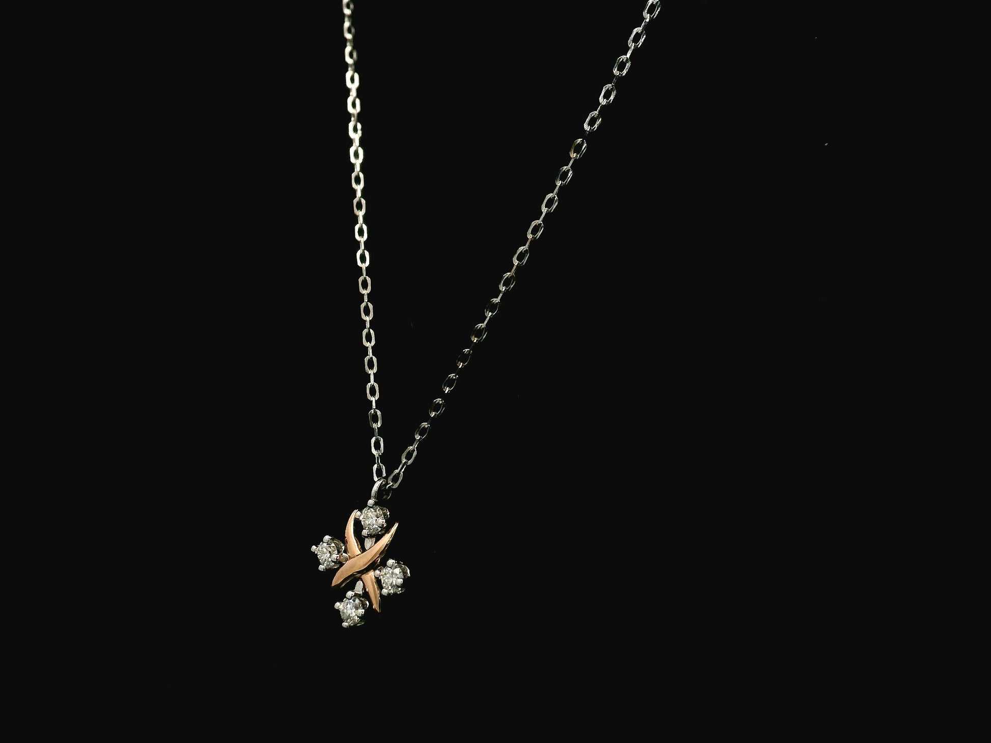 Two-tone diamond pendant necklace in 18K white and rose gold with 0.25 carats of natural diamonds by Emirates Diamonds