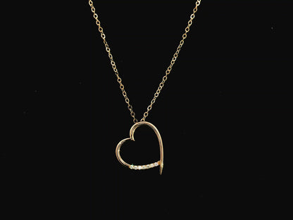 Diamond heart pendant necklace in 18K yellow gold with chain by Emirates Diamonds
