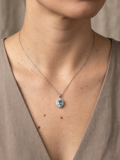 Swiss blue topaz and diamond halo pendant in 18K white gold – Emirates Diamonds