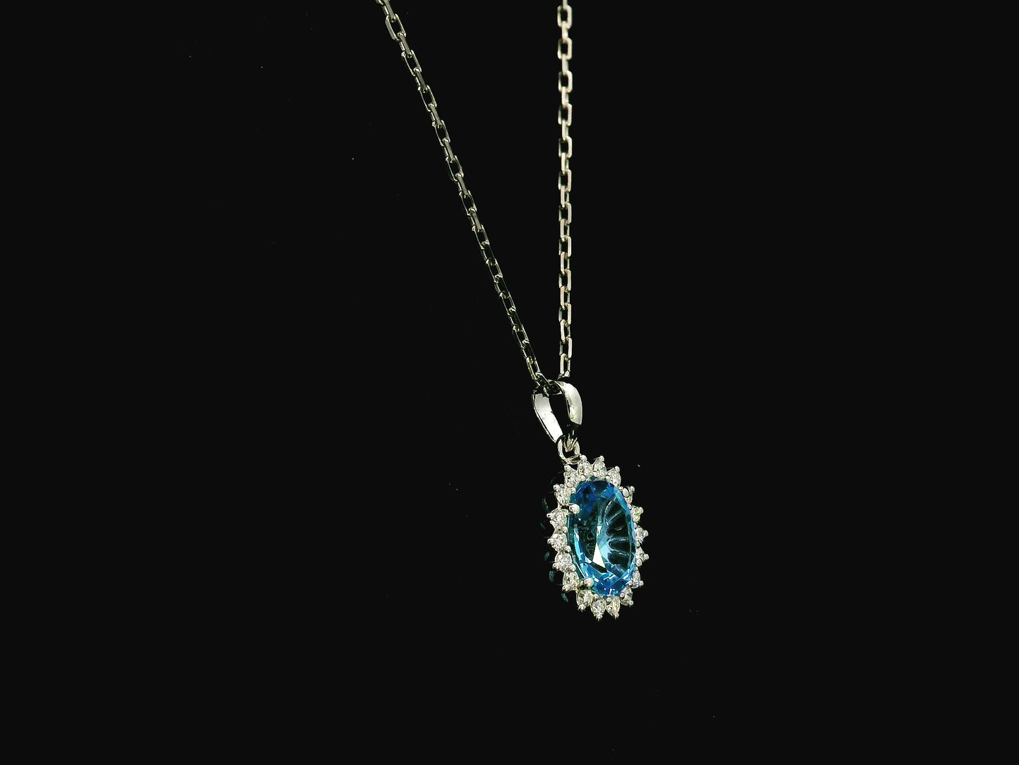 Swiss blue topaz and diamond halo pendant in 18K white gold – Emirates Diamonds