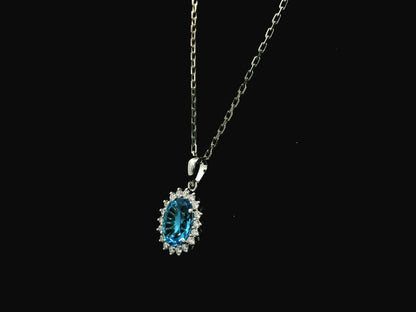 Swiss blue topaz and diamond halo pendant in 18K white gold – Emirates Diamonds