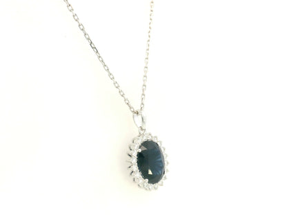 Blue Sapphire & Diamond Halo Pendant in 18K White Gold