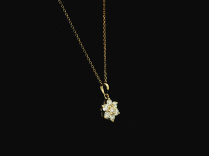 Diamond flower cluster pendant in 18K yellow gold featuring 0.55 carats of diamonds by Emirates Diamonds.