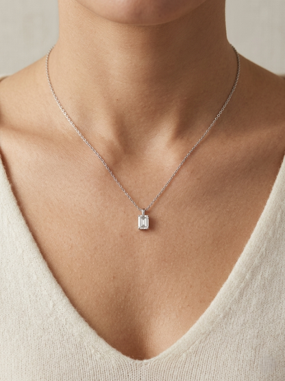 Emerald cut diamond solitaire pendant necklace in 18K white gold with chain