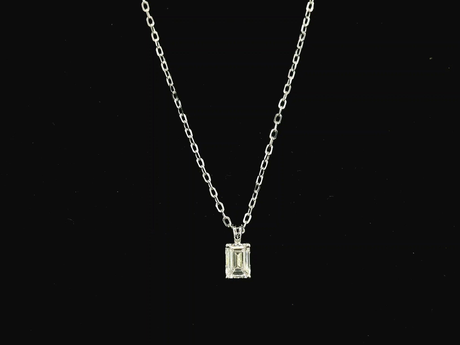 Emerald cut diamond solitaire pendant necklace in 18K white gold with chain