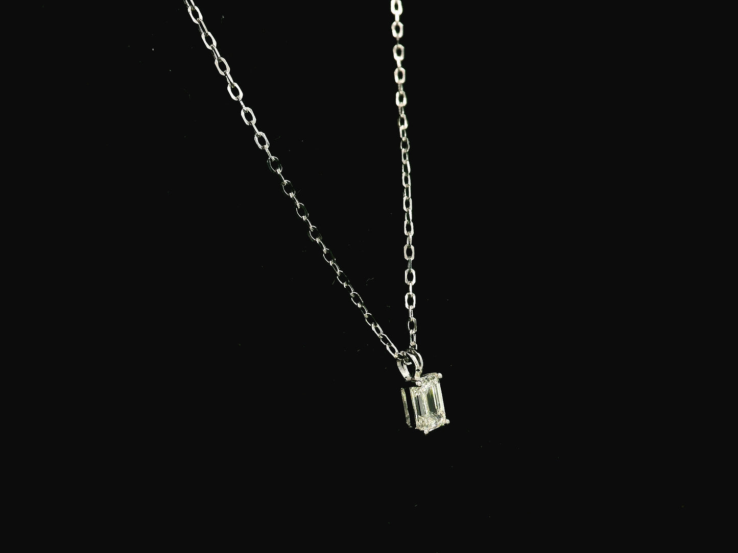 Emerald cut diamond solitaire pendant necklace in 18K white gold with chain