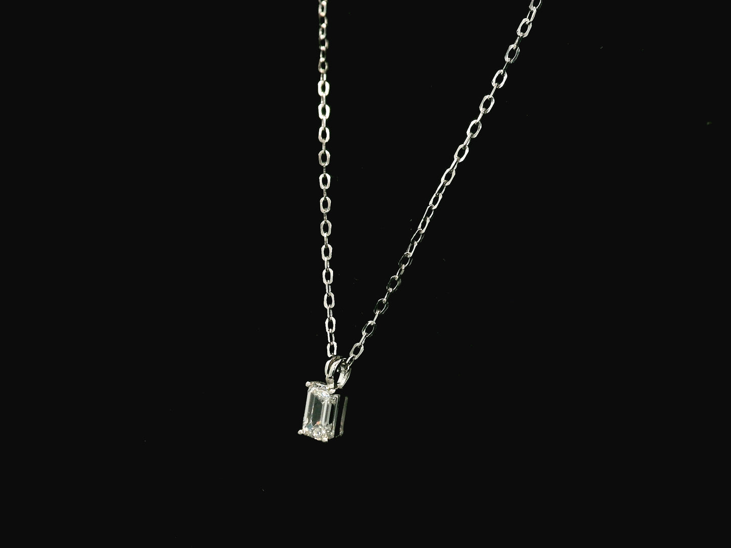 Emerald cut diamond solitaire pendant necklace in 18K white gold with chain