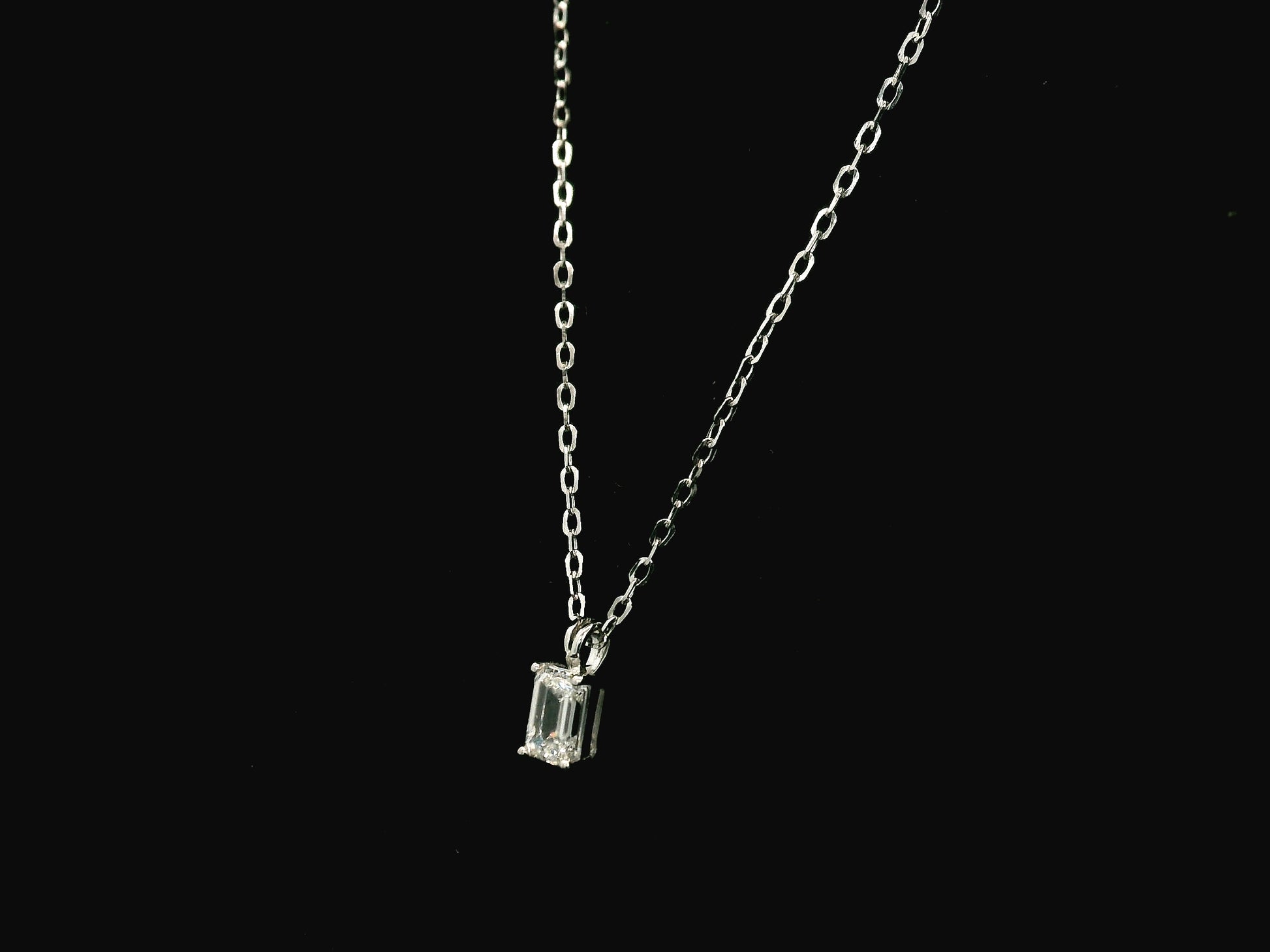 Emerald cut diamond solitaire pendant necklace in 18K white gold with chain