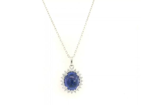 Cabochon tanzanite diamond halo pendant in 18K white gold