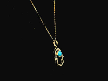 18K yellow gold turquoise hamsa pendant with diamond detail 0.34 carat