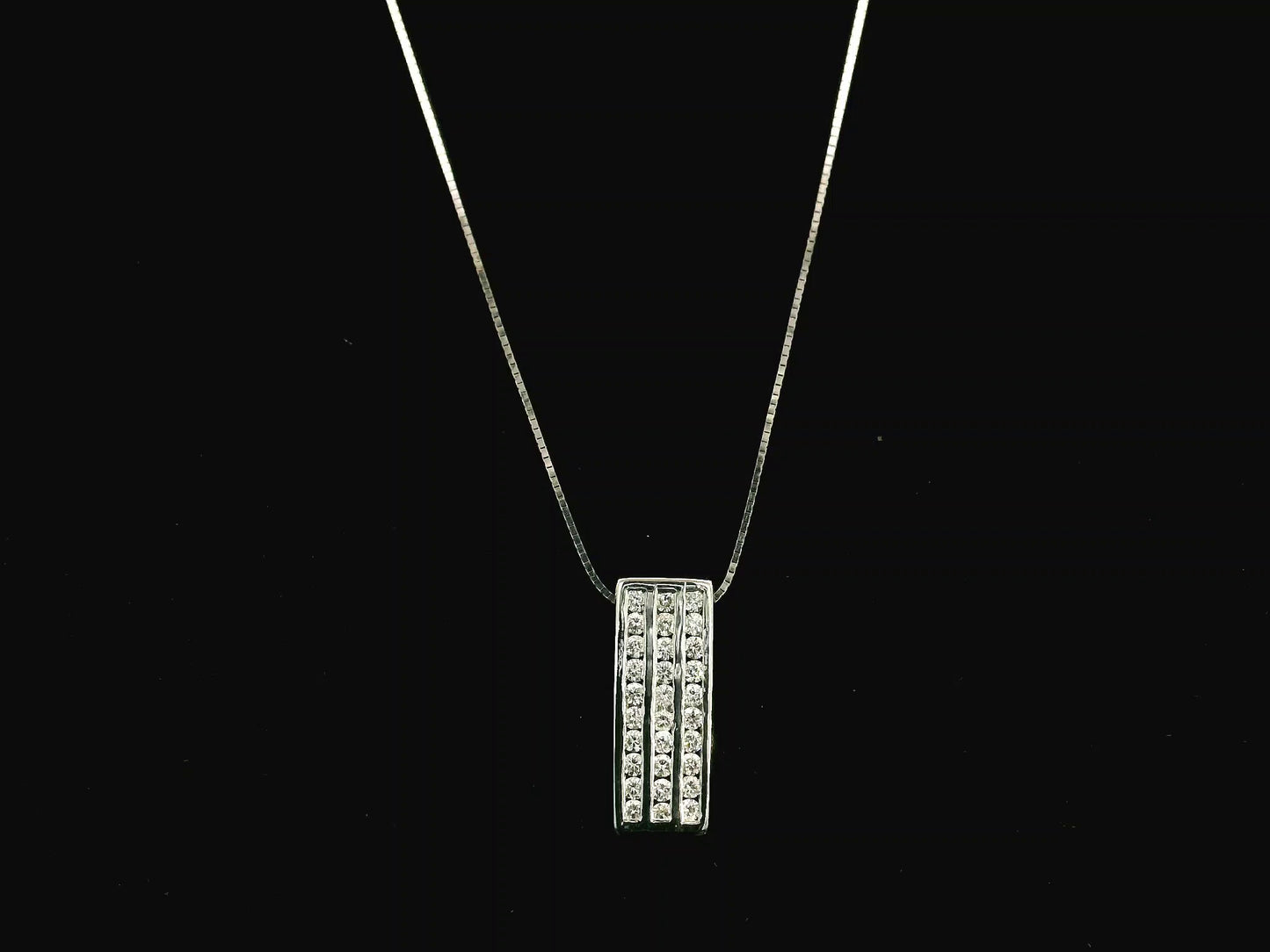 18K white gold diamond bar pendant featuring three vertical rows of natural diamonds with a total diamond weight of 0.54 carat.
