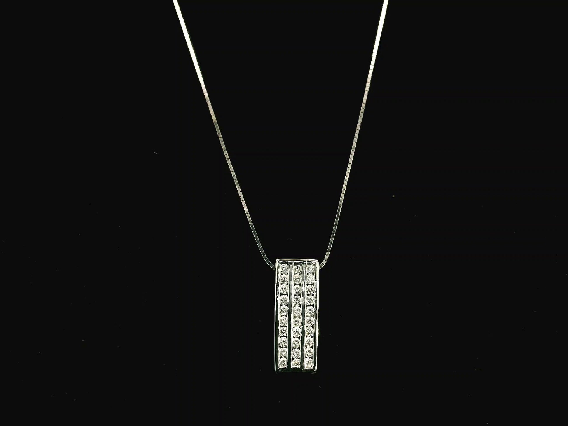 18K white gold diamond bar pendant featuring three vertical rows of natural diamonds with a total diamond weight of 0.54 carat.