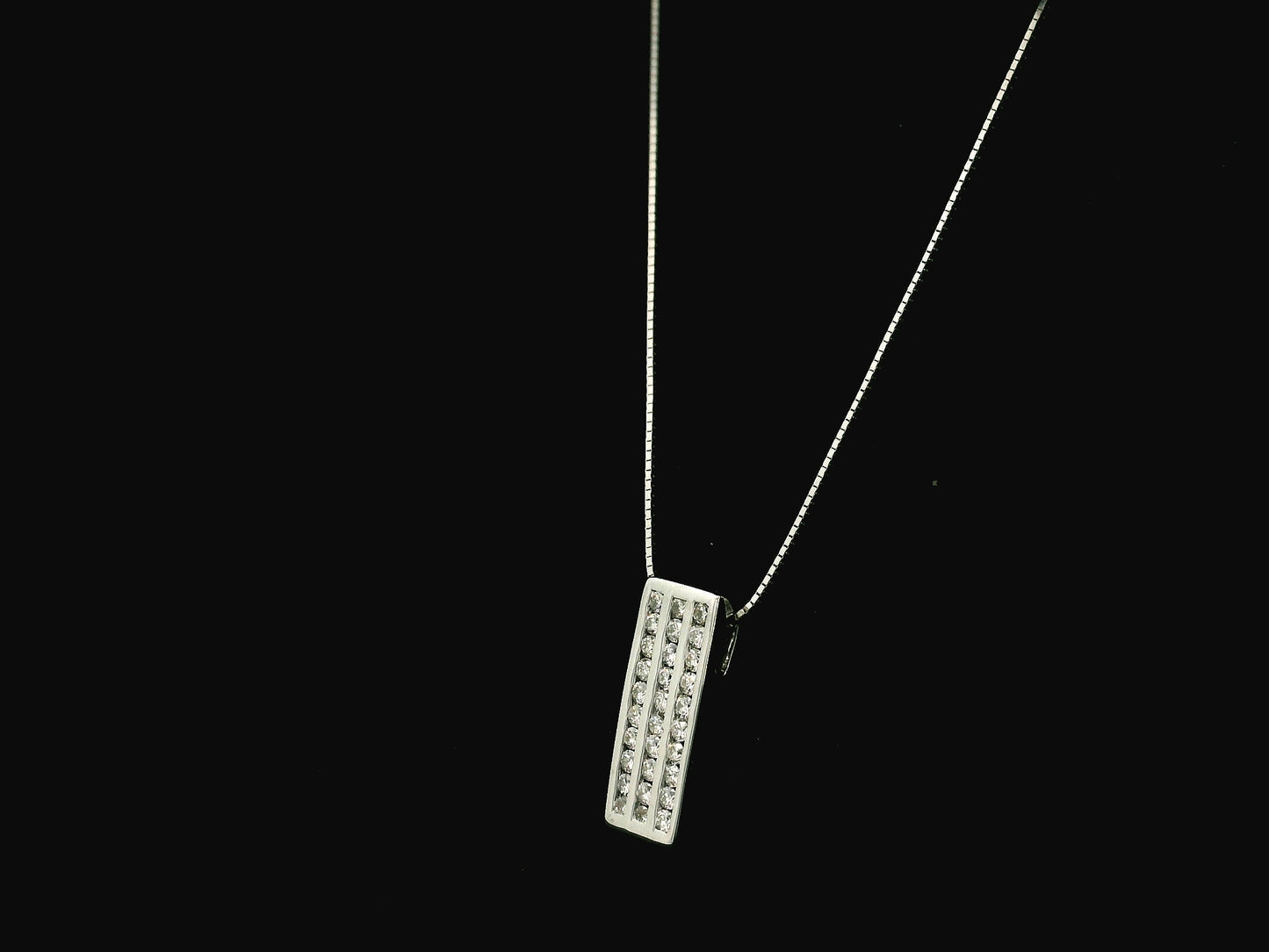 18K white gold diamond bar pendant featuring three vertical rows of natural diamonds with a total diamond weight of 0.54 carat.