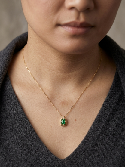 Emerald cut emerald geometric pendant necklace in 18K yellow gold with diamond accents