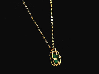 Emerald cut emerald geometric pendant necklace in 18K yellow gold with diamond accents