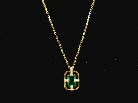Emerald cut emerald geometric pendant necklace in 18K yellow gold with diamond accents