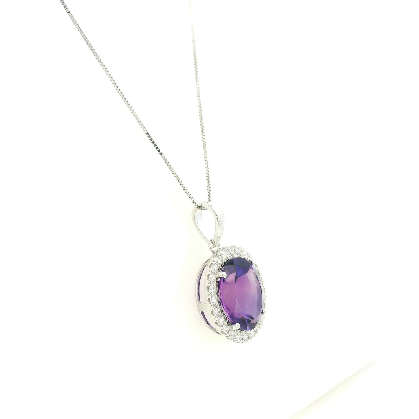 18K white gold amethyst and diamond halo pendant with oval purple gemstone