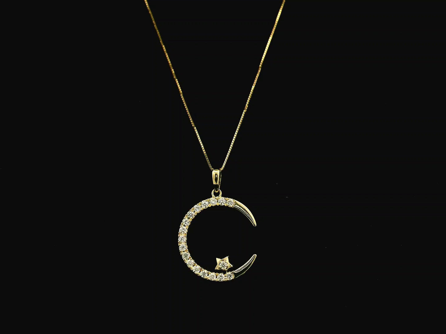 Diamond crescent moon pendant in 18K yellow gold by Emirates Diamonds