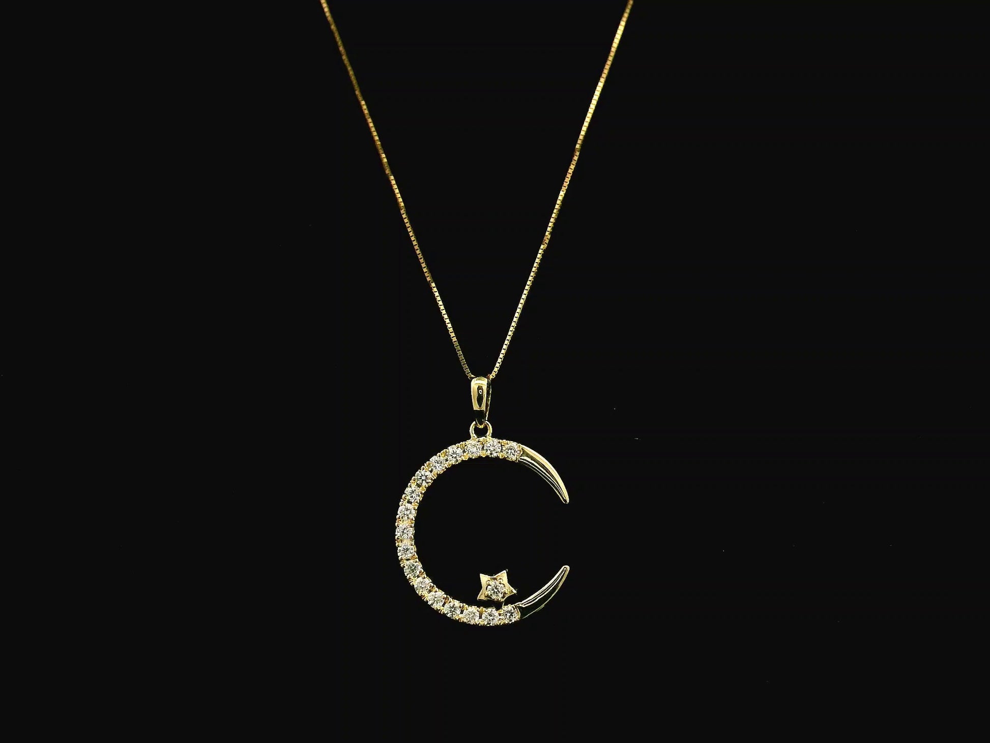 Diamond crescent moon pendant in 18K yellow gold by Emirates Diamonds