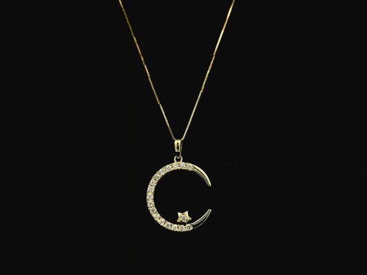 Diamond crescent moon pendant in 18K yellow gold by Emirates Diamonds