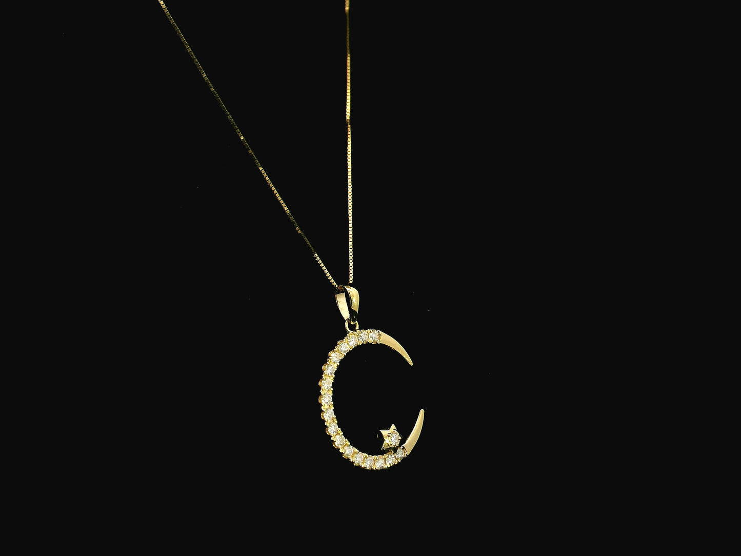 Diamond crescent moon pendant in 18K yellow gold by Emirates Diamonds